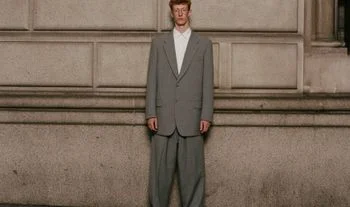 a man in a large suit 