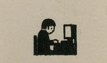 a student staring at a screen with a gold square in the background