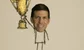 a crudely drawn man holding a giant golden cup. He has the face of John Waldron