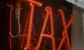 tax written in red lights 